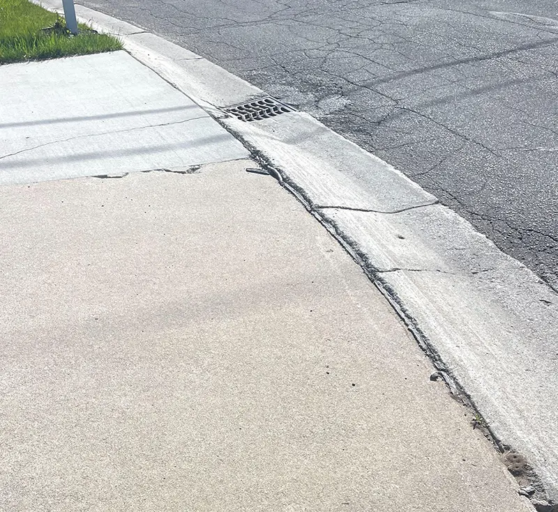 Driveway Concrete Raising Near the Curb in Pleasant Hope, MO